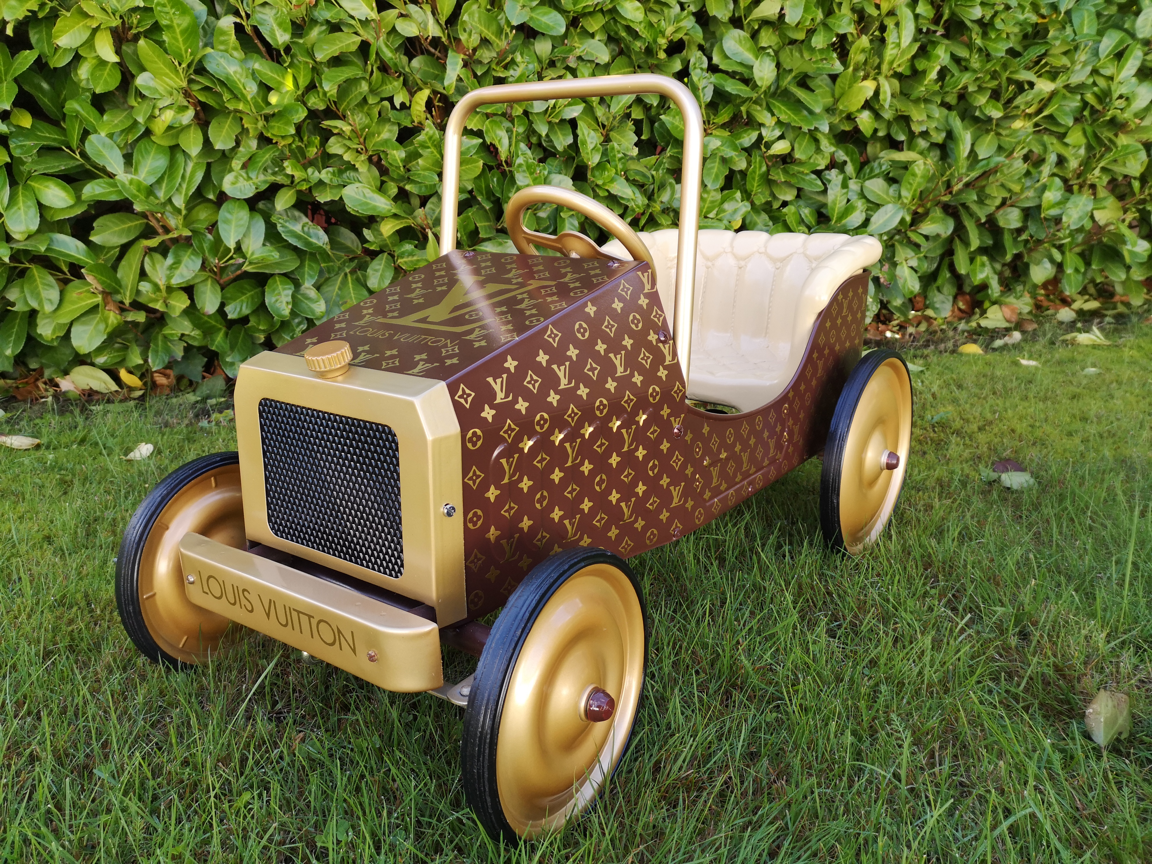 Vintage pedal car inspired by Louis Vuitton